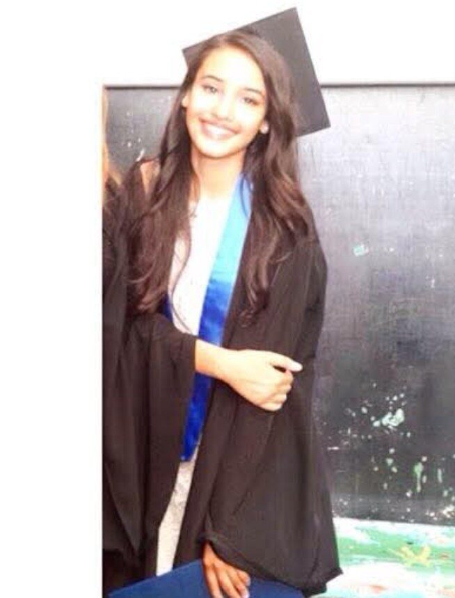 HHS III alumna in graduation attire